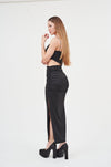 Stylish Black Strapless Maxi Dress with Side Slit
A sleek black strapless maxi dress with a daring side slit, showcasing the model's long, lean legs.