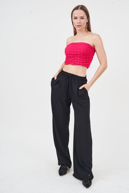 Stylish fuchsia crop top for trendy women on white background