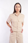 Casual beige linen top for women, showcasing a minimalist and contemporary design.