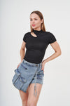 Stylish Denim Shorts with Distressed Accents - Fashionable woman wearing cut-out black top and denim shorts from H Apparel