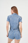 Casual denim romper with puff sleeves on display