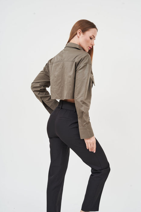 Fashionable taupe belted high-waist trousers with tailored fit, showcased on a female model against a plain background.