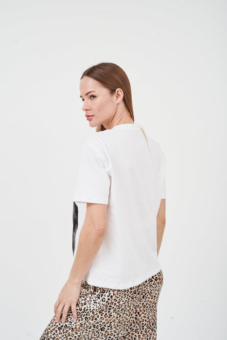 Stylish graphic text oversized tee by H Apparel, showcasing a model wearing the white t-shirt against a plain background.