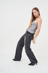 Stylish Gray Lace-Up Women's Cargo Pants by H Apparel
Featuring a female model wearing gray denim cargo pants with lace-up detailing, paired with a gray tank top.