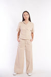 Beige linen-blend wide-leg pants and matching utility jacket from H Apparel brand, featured on a female model against a plain white background.