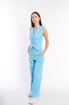 Stylish turquoise linen blend jumpsuit from H Apparel, featuring a sleeveless design and wide-leg pants for a chic, comfortable look.