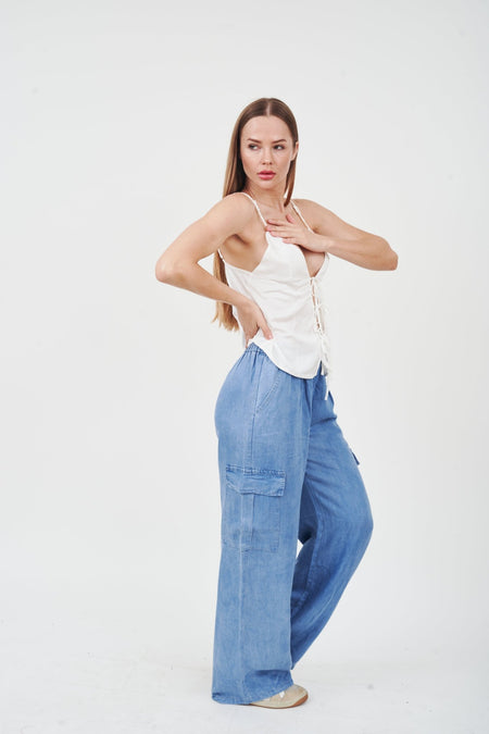 Flattering wide-leg denim jeans from H Apparel, featuring a stylish model in a white tank top.