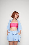 Stylish chambray shorts and crop top by H Apparel, featuring a trendy pink accent.