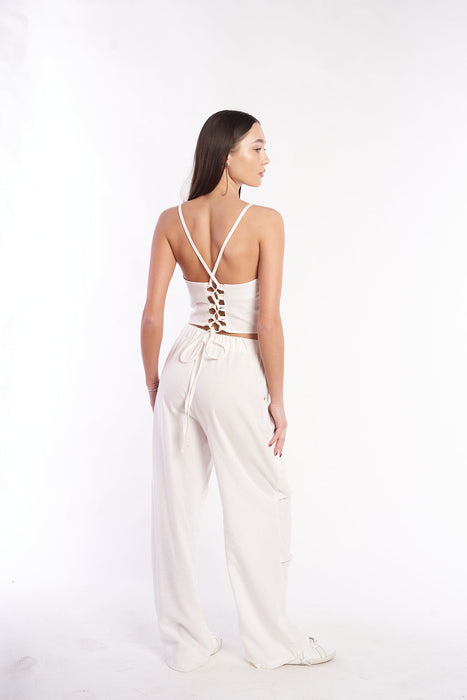 Elegant linen crop top with a chic crisscross back design by H Apparel, showcasing a stylish and modern look.