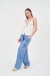 Elegant satin top with effortless style on female model against white background