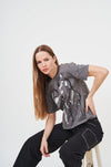 Stylish graphic print oversized t-shirt for women, featuring a relaxed fit and contemporary design.