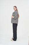 Stylish leopard print faux fur open-front jacket showcasing contemporary fashion trends.